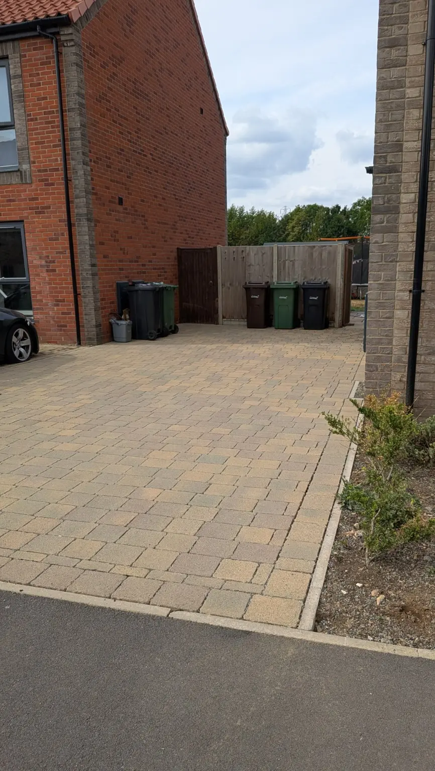 Block-paved driveway left clean and tidy after professional pressure washing