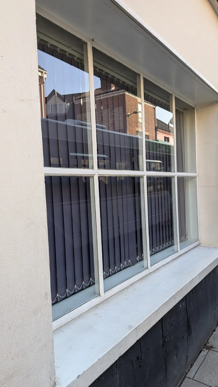 Large multi-pane window and sill after professional window cleaning