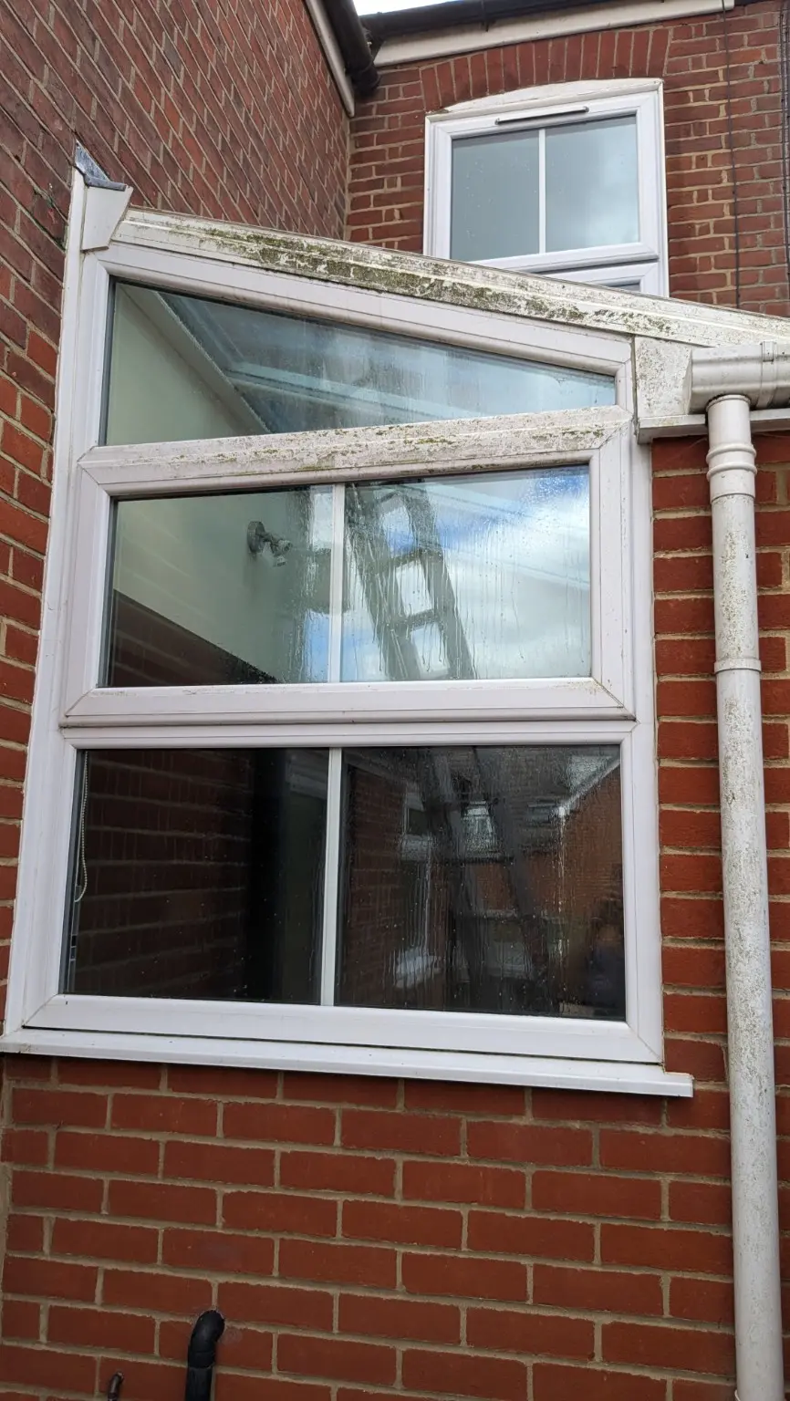 Conservatory exterior glass and frames before professional cleaning