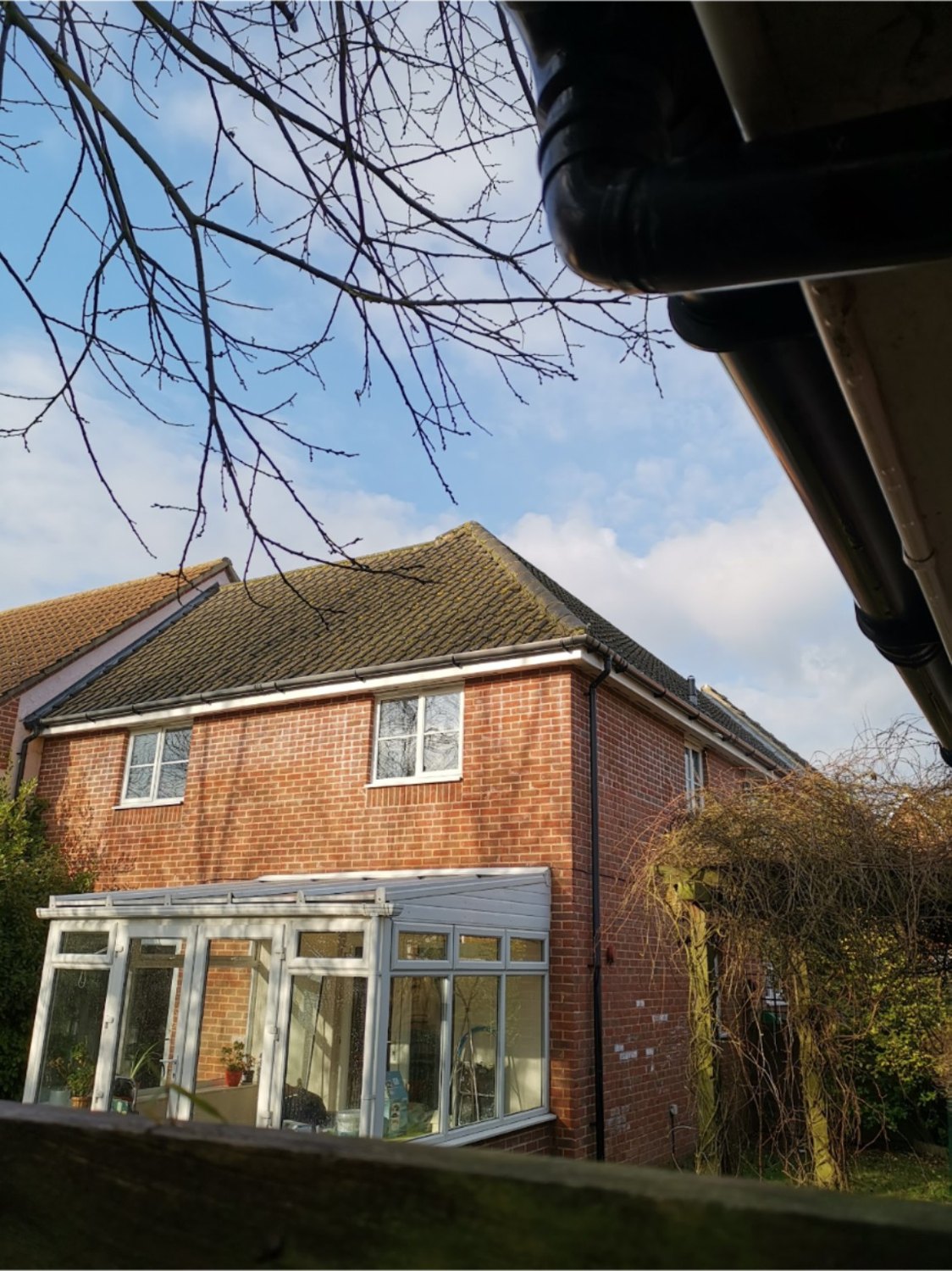 Home with conservatory exterior cleaning
