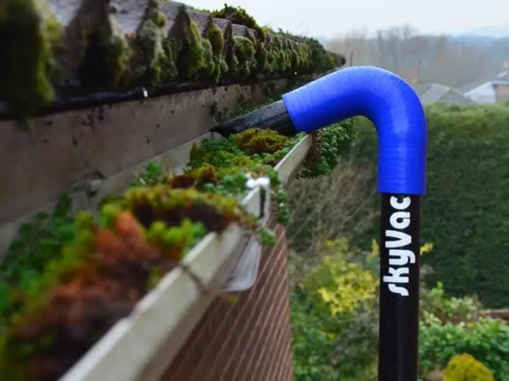 Gutter clearing equipment working from ground level