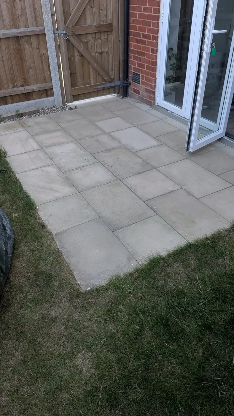 Sandstone patio before pressure washing