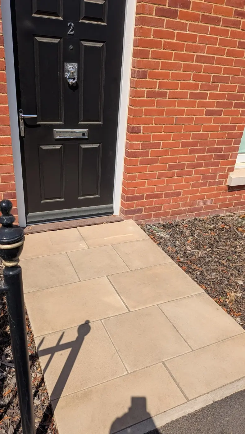 Sandstone entrance path before professional pressure washing